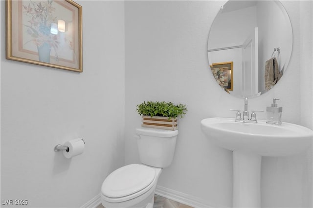 7260 Grace Estate Ave, Las Vegas, NV 89113 - half bathroom with toilet, baseboards, and a sink