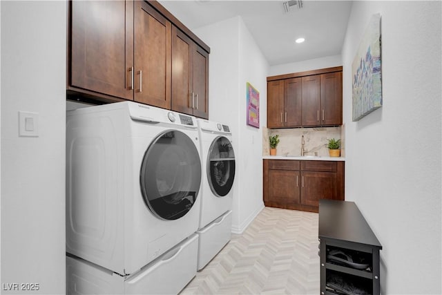 7260 Grace Estate Ave, Las Vegas, NV 89113 - laundry room featuring separate washer and dryer, cabinet space, and recessed lighting