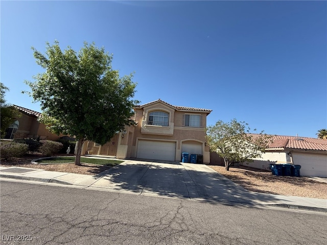 6351 Davidson Ct, Las Vegas, NV 89110 - view of front of house with an attached garage, stucco siding, concrete driveway, and a tiled roof