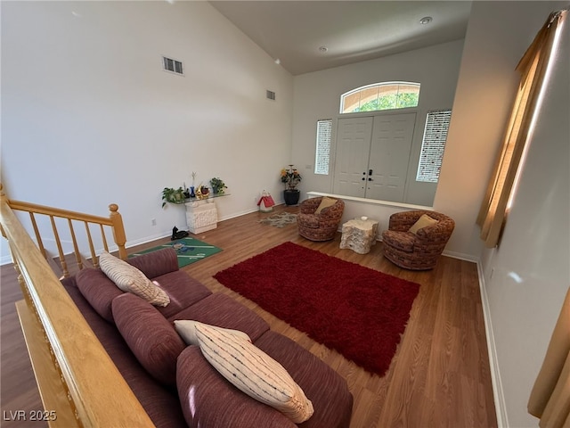 6351 Davidson Ct, Las Vegas, NV 89110 - living area featuring high vaulted ceiling, wood finished floors, and baseboards