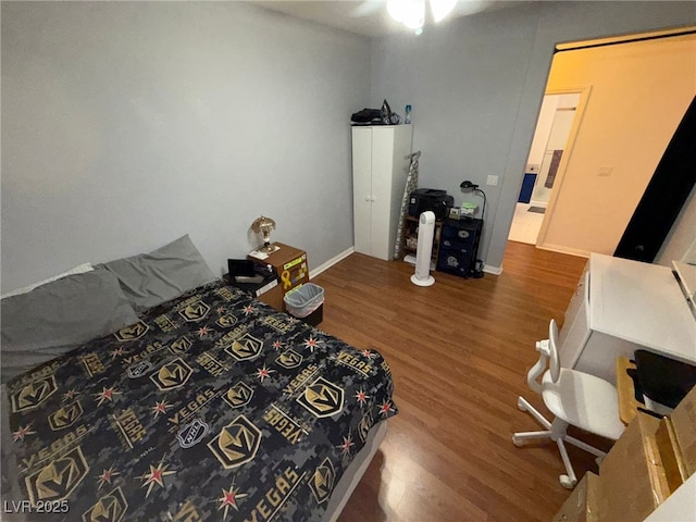 6351 Davidson Ct, Las Vegas, NV 89110 - bedroom featuring wood finished floors and baseboards
