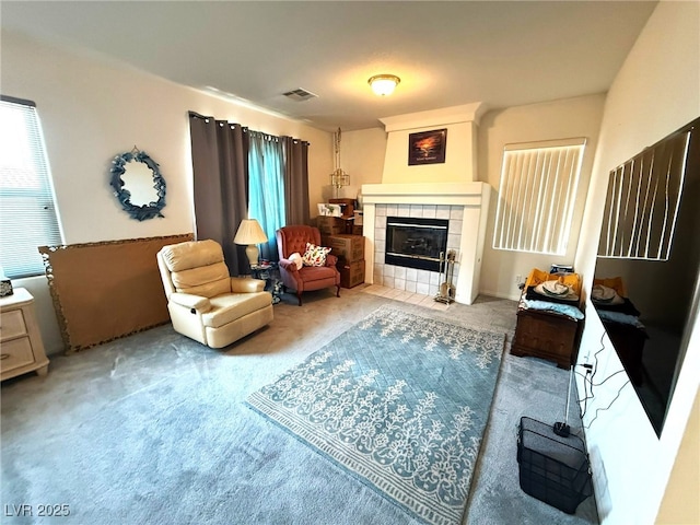 6351 Davidson Ct, Las Vegas, NV 89110 - carpeted living area with a tile fireplace