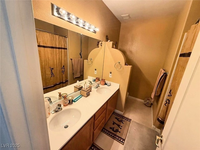 6351 Davidson Ct, Las Vegas, NV 89110 - bathroom featuring toilet, double vanity, and tile patterned flooring