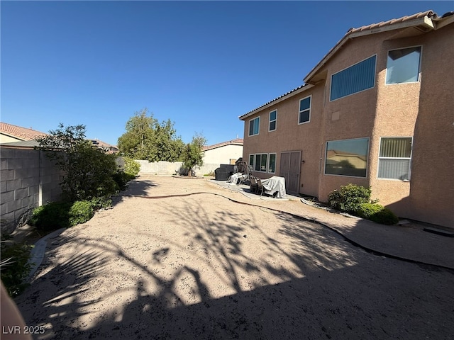 6351 Davidson Ct, Las Vegas, NV 89110 - fenced backyard featuring a patio