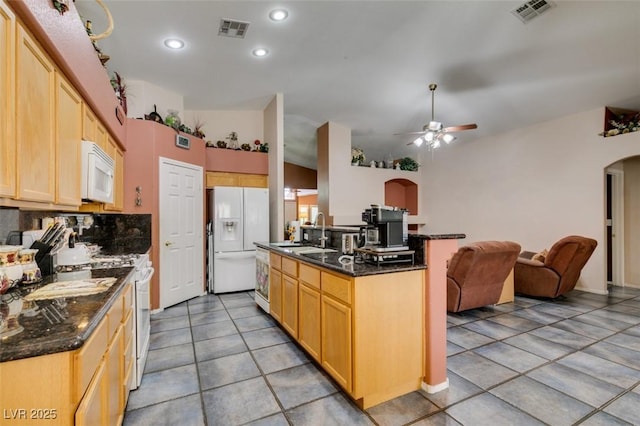 1017 Guided Dancer Ave, Henderson, NV 89015 - kitchen featuring white appliances, arched walkways, a sink, a ceiling fan, and open floor plan
