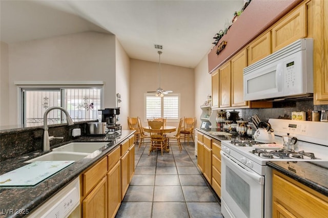 1017 Guided Dancer Ave, Henderson, NV 89015 - kitchen featuring white appliances, vaulted ceiling, tile patterned flooring, tasteful backsplash, and a sink