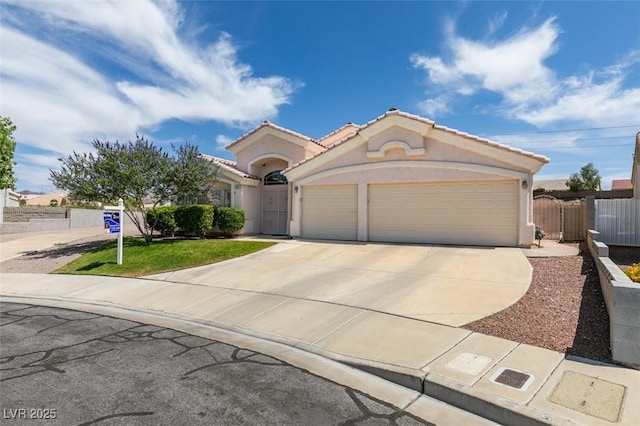 1017 Guided Dancer Ave, Henderson, NV 89015 - view of front of home featuring concrete driveway, a garage, and stucco siding