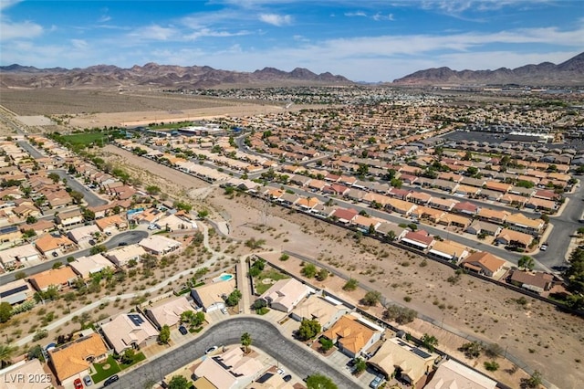 1017 Guided Dancer Ave, Henderson, NV 89015 - aerial overview of property's location with a mountain backdrop and nearby suburban area