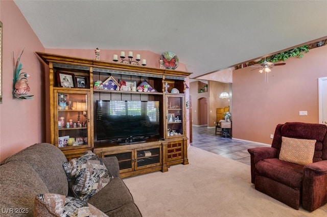 1017 Guided Dancer Ave, Henderson, NV 89015 - tiled living room with arched walkways, a ceiling fan, and lofted ceiling