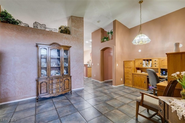1017 Guided Dancer Ave, Henderson, NV 89015 - tiled office with arched walkways, high vaulted ceiling, and baseboards