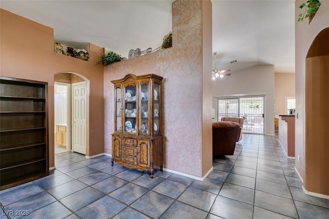 1017 Guided Dancer Ave, Henderson, NV 89015 - tiled foyer with a ceiling fan, high vaulted ceiling, arched walkways, and baseboards