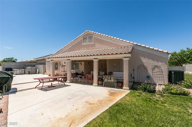 1017 Guided Dancer Ave, Henderson, NV 89015 - back of property featuring a patio area, a tile roof, stucco siding, and central AC unit