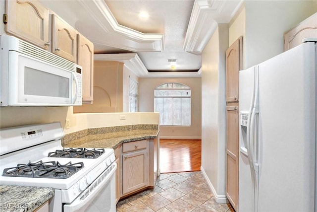 8725 Red Rio Dr Unit 203, Las Vegas, NV 89128 - kitchen featuring white appliances, crown molding, baseboards, light brown cabinets, and light stone counters