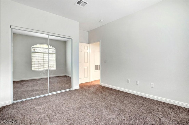 8725 Red Rio Dr Unit 203, Las Vegas, NV 89128 - unfurnished bedroom featuring carpet flooring, a closet, and baseboards