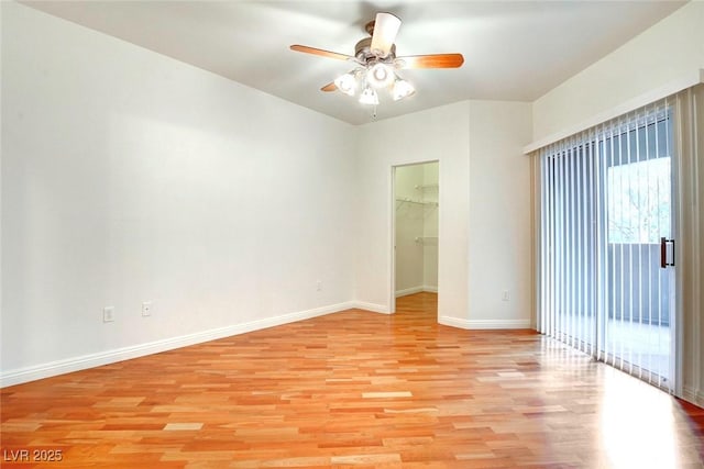 8725 Red Rio Dr Unit 203, Las Vegas, NV 89128 - empty room with light wood-type flooring, ceiling fan, and baseboards