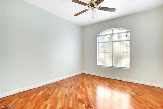8725 Red Rio Dr Unit 203, Las Vegas, NV 89128 - empty room with healthy amount of natural light, light wood-style floors, and baseboards