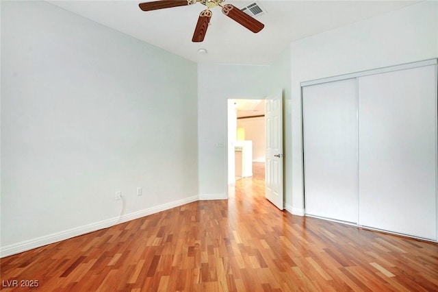 8725 Red Rio Dr Unit 203, Las Vegas, NV 89128 - unfurnished bedroom with light wood finished floors, a closet, and baseboards
