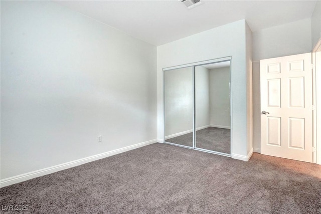 8725 Red Rio Dr Unit 203, Las Vegas, NV 89128 - unfurnished bedroom featuring carpet, a closet, and baseboards