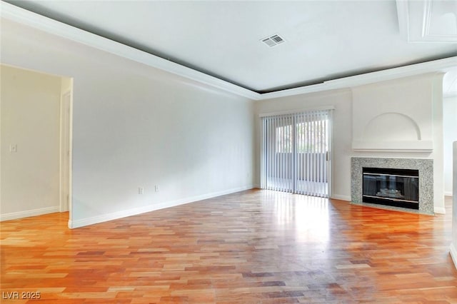 8725 Red Rio Dr Unit 203, Las Vegas, NV 89128 - unfurnished living room with baseboards, light wood-style flooring, and a tile fireplace