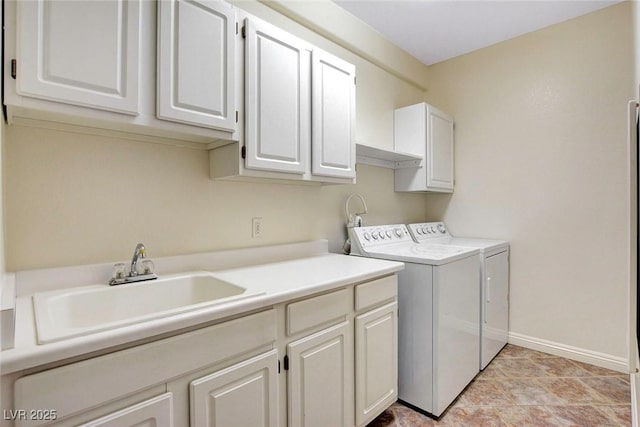 8725 Red Rio Dr Unit 203, Las Vegas, NV 89128 - laundry area with cabinet space, washing machine and dryer, and baseboards