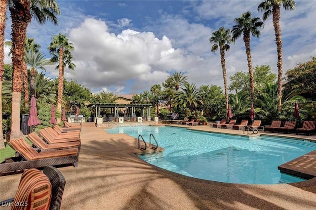 8725 Red Rio Dr Unit 203, Las Vegas, NV 89128 - community pool featuring a pergola and a patio area