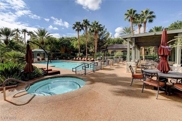 8725 Red Rio Dr Unit 203, Las Vegas, NV 89128 - community pool featuring a hot tub and a patio