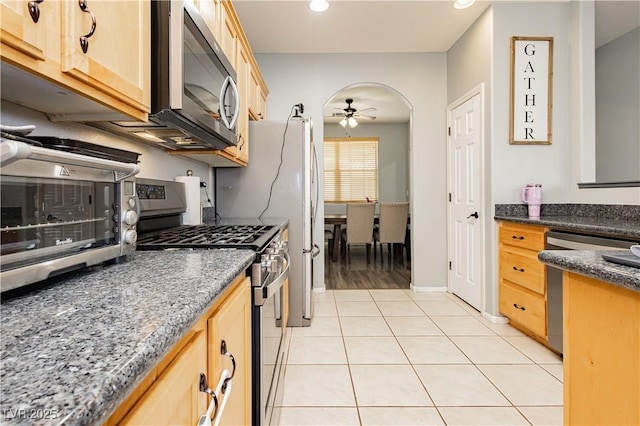 561 Fork Mesa Ct, Henderson, NV 89015 - kitchen featuring stainless steel appliances, light brown cabinetry, a ceiling fan, light tile patterned flooring, and recessed lighting