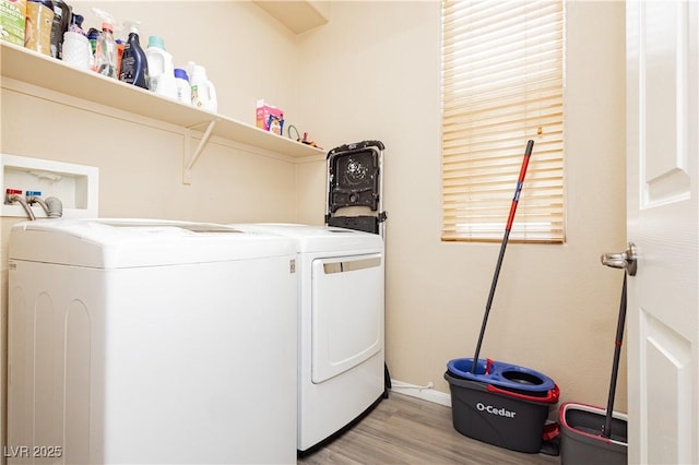 561 Fork Mesa Ct, Henderson, NV 89015 - laundry room with independent washer and dryer, light wood-type flooring, and baseboards