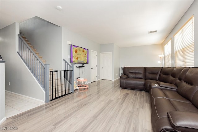 561 Fork Mesa Ct, Henderson, NV 89015 - living room with wood finished floors, baseboards, and stairs