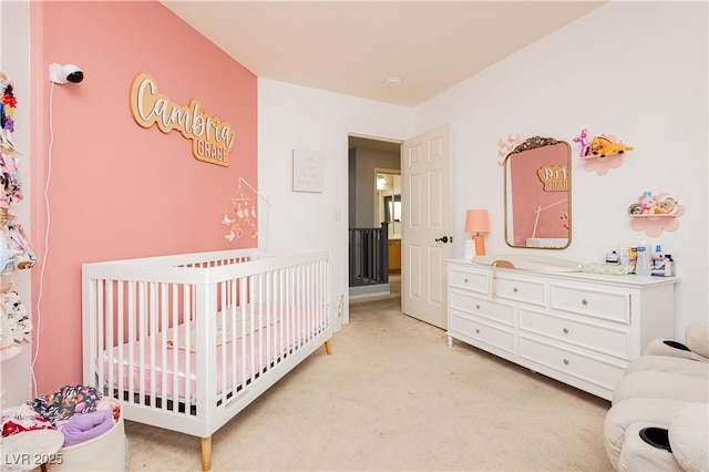 561 Fork Mesa Ct, Henderson, NV 89015 - bedroom with a crib and light carpet