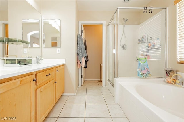 561 Fork Mesa Ct, Henderson, NV 89015 - bathroom with a stall shower, double vanity, a garden tub, and tile patterned flooring