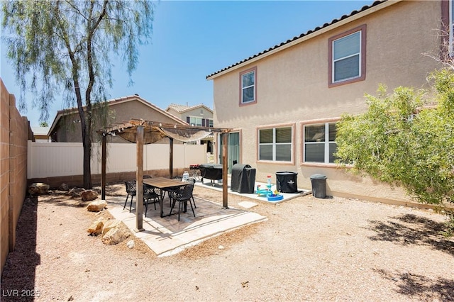 561 Fork Mesa Ct, Henderson, NV 89015 - rear view of house with a pergola, stucco siding, a fenced backyard, and a patio area