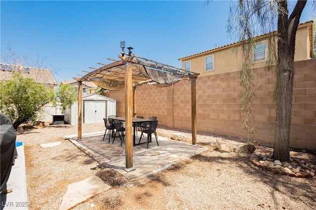 561 Fork Mesa Ct, Henderson, NV 89015 - fenced backyard with a pergola, a patio, and outdoor dining space