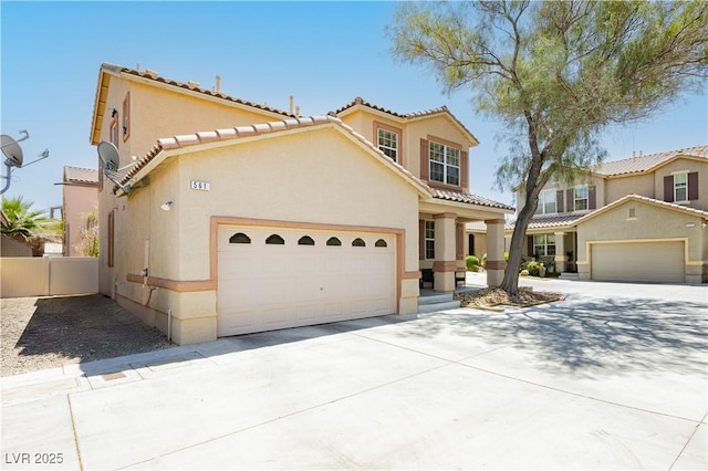 561 Fork Mesa Ct, Henderson, NV 89015 - mediterranean / spanish-style home with stucco siding, a tile roof, and an attached garage