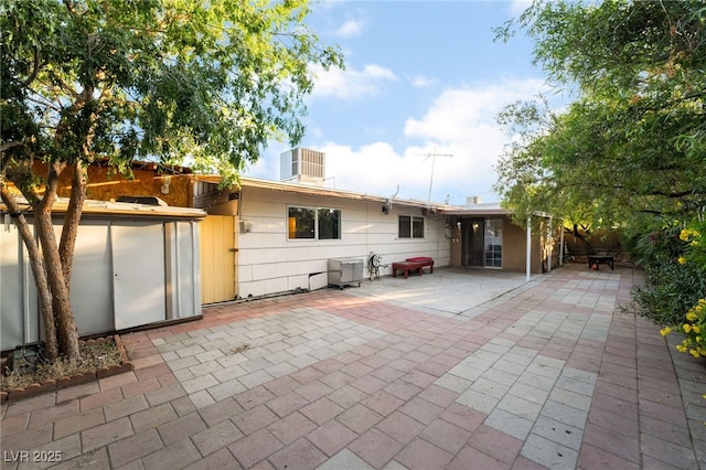 6608 Burgundy Way, Las Vegas, NV 89107 - rear view of property with a patio area and central AC