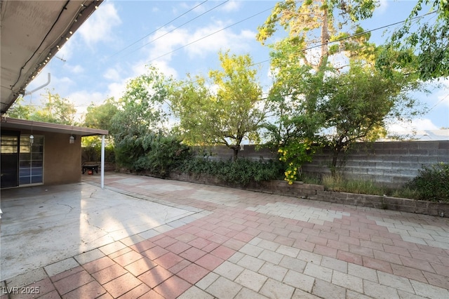 6608 Burgundy Way, Las Vegas, NV 89107 - fenced backyard with a patio area