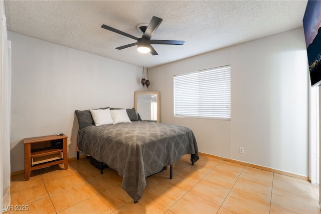 6608 Burgundy Way, Las Vegas, NV 89107 - bedroom with light tile patterned floors, a textured ceiling, and a ceiling fan
