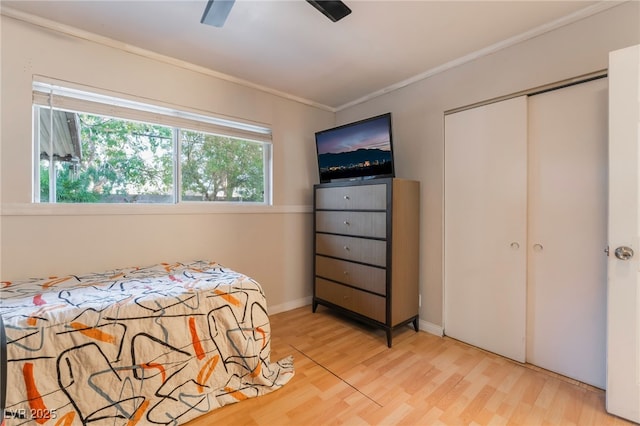 6608 Burgundy Way, Las Vegas, NV 89107 - bedroom with light wood finished floors, ornamental molding, a closet, and a ceiling fan