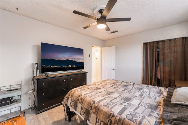6608 Burgundy Way, Las Vegas, NV 89107 - bedroom with a textured ceiling, a ceiling fan, and light wood finished floors