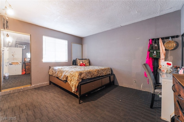 6608 Burgundy Way, Las Vegas, NV 89107 - bedroom with carpet, a textured ceiling, and an AC wall unit