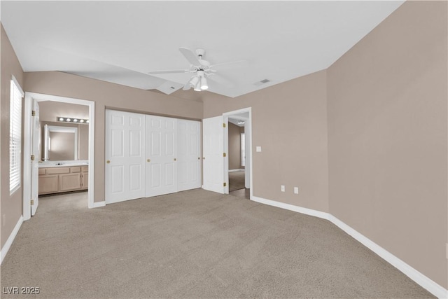 104 Hutton Ln, Las Vegas, NV 89145 - unfurnished bedroom with light carpet, baseboards, ensuite bath, and a ceiling fan