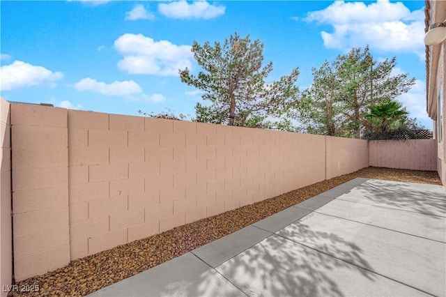 104 Hutton Ln, Las Vegas, NV 89145 - fenced backyard with a patio