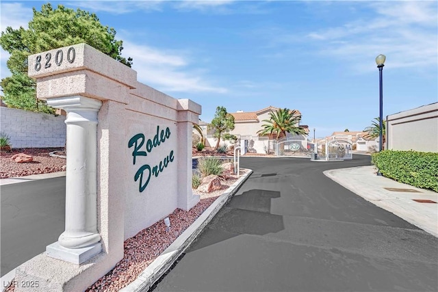 104 Hutton Ln, Las Vegas, NV 89145 - view of asphalt road with a residential view and street lighting