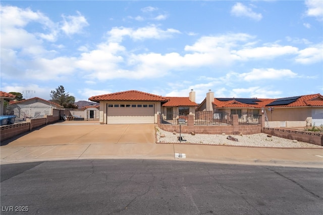 411 Monmouth Ct, Henderson, NV 89015 - mediterranean / spanish-style home with a fenced front yard, a tile roof, an attached garage, stucco siding, and driveway