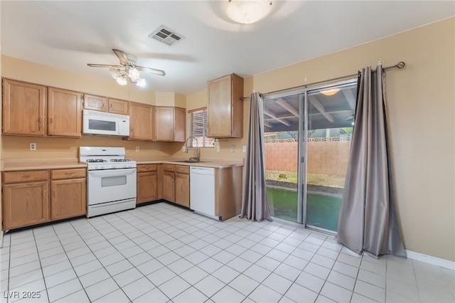 411 Monmouth Ct, Henderson, NV 89015 - kitchen with white appliances, light countertops, a sink, and ceiling fan