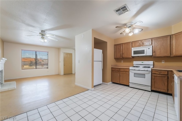 411 Monmouth Ct, Henderson, NV 89015 - kitchen featuring white appliances, ceiling fan, light countertops, and open floor plan