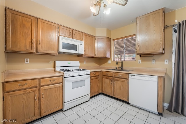 411 Monmouth Ct, Henderson, NV 89015 - kitchen with white appliances, a sink, and light countertops