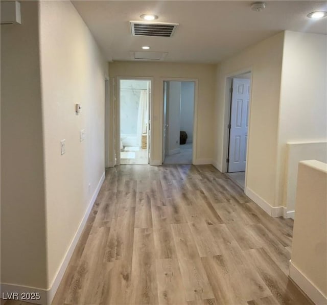 11074 Caramel Crest Ct, Las Vegas, NV 89135 - hallway with light wood-style flooring, attic access, baseboards, and recessed lighting