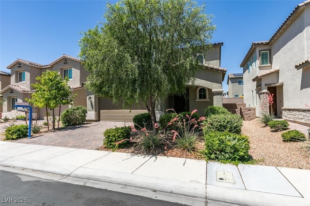 4633 Fragrant St, North Las Vegas, NV 89031 - mediterranean / spanish home with stucco siding, decorative driveway, and a tile roof