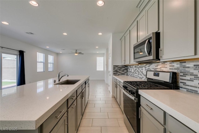4633 Fragrant St, North Las Vegas, NV 89031 - kitchen featuring stainless steel appliances, a sink, tasteful backsplash, recessed lighting, and a ceiling fan
